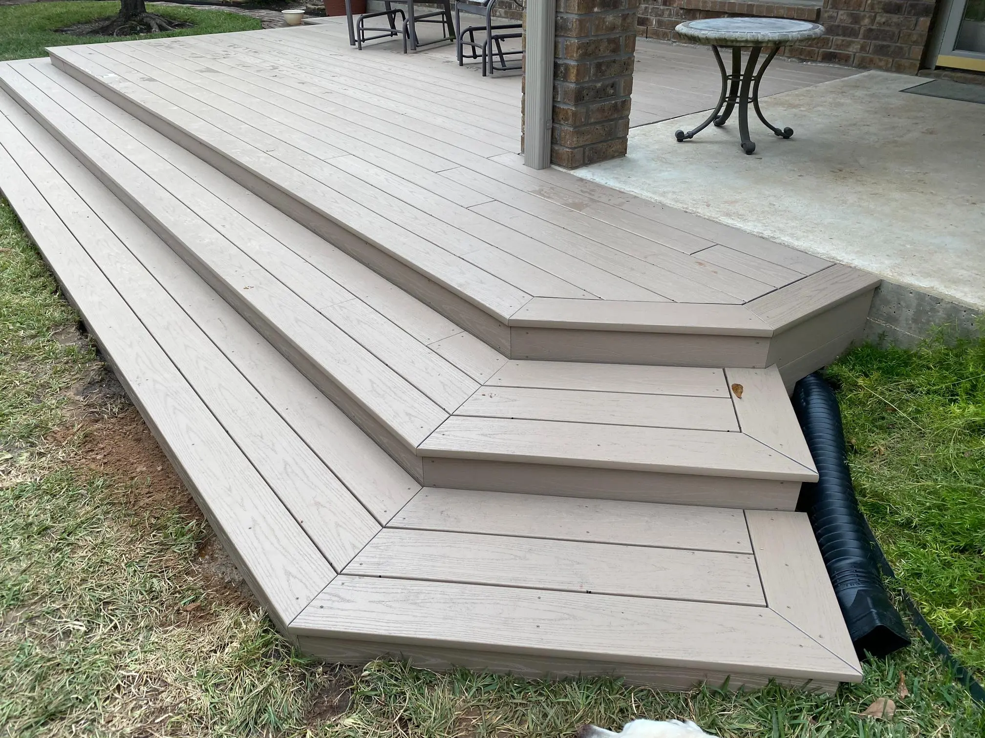 Modern wooden outdoor steps with angular design and clean lines.